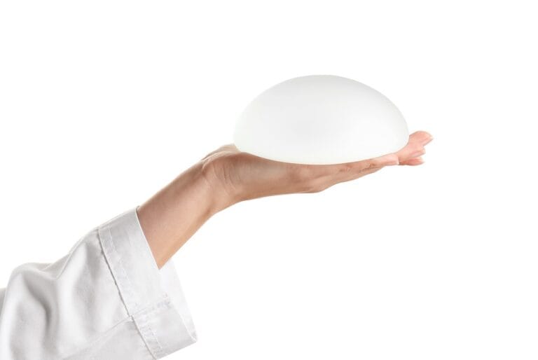 doctor holding silicone implant